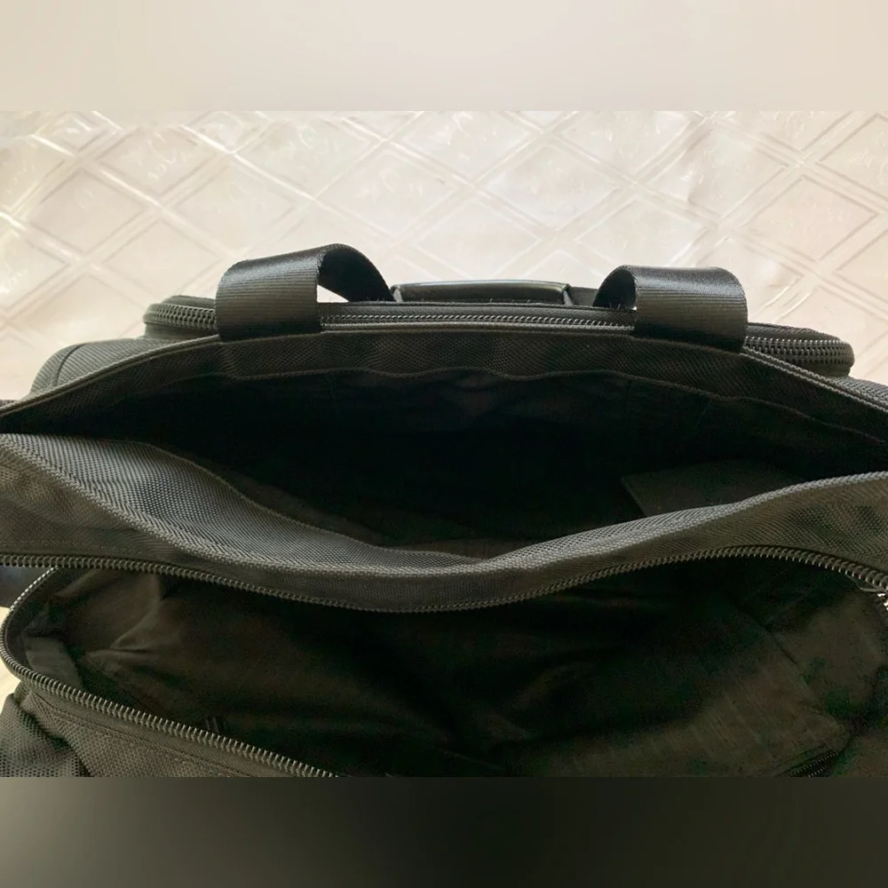 Tumi Black Travel Bag with Adjustable Strap